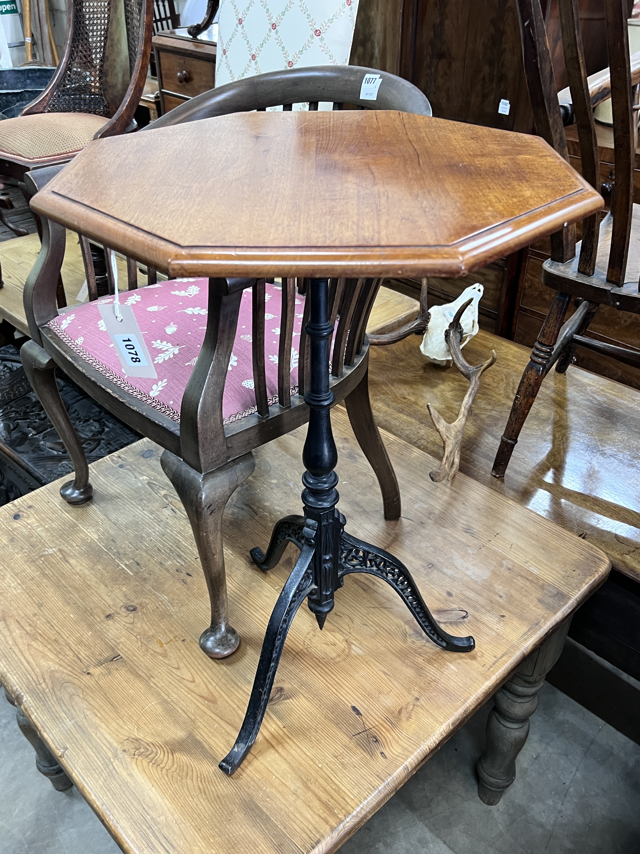 A Victorian and later mahogany and cast iron octagonal top tripod table, width 50cm, height 74cm